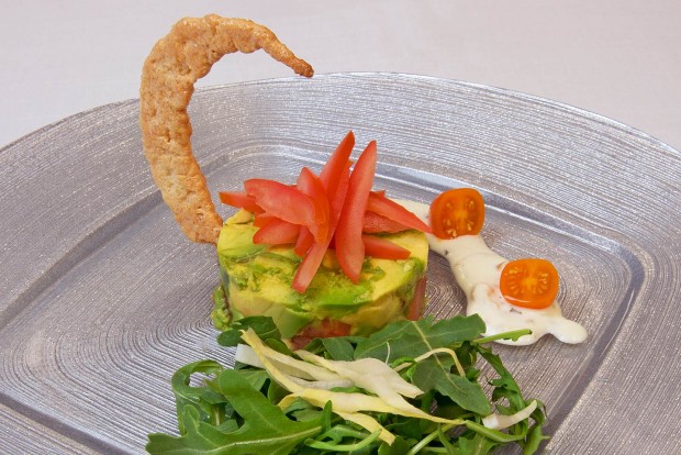 delicious gourmet kosher salad featuring a crispy crescent moon cracker prepared by danziger kosher catering and served on a circle square charger plate