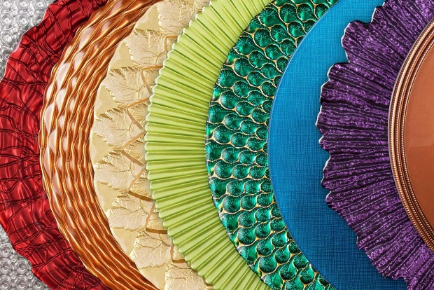 a huge photo montage of designer charger plates from mandarin orange trading company, all arranged in a rainbow